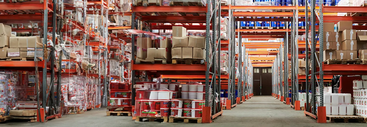 banner showcasing two workers walking outside a warehouse facility with a forklift parked nearby